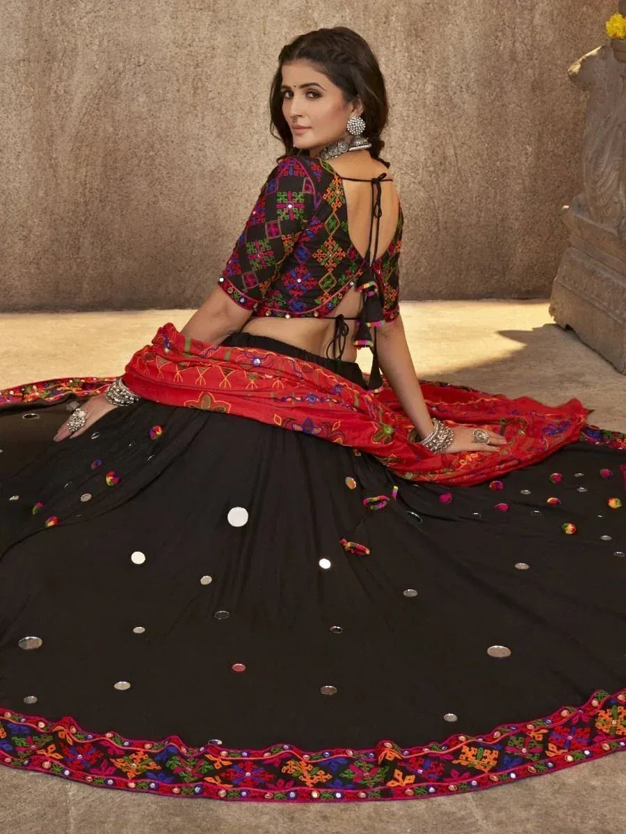 Black and red embroidered lehenga choli with mirror work, perfect for Indian ethnic occasions