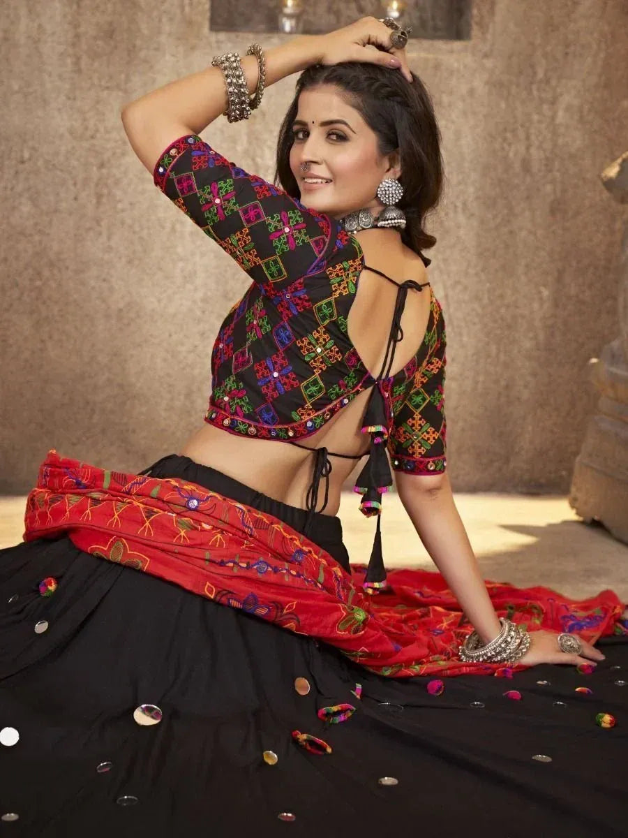 Black and red embroidered lehenga choli with mirror work, perfect for Indian ethnic wear