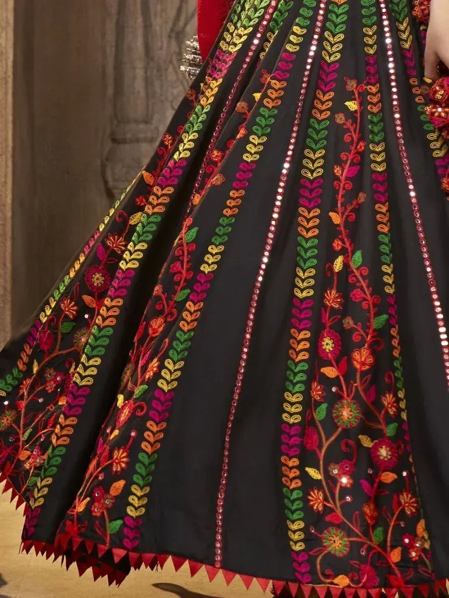 Black lehenga with vibrant floral embroidery and mirror work, perfect for Indian ethnic wear