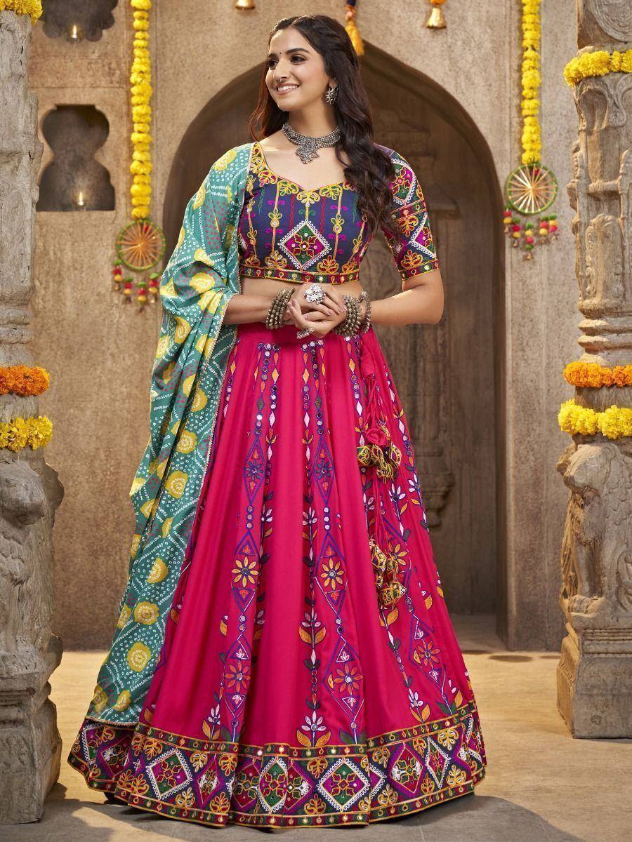 Vibrant pink embroidered lehenga choli with green dupatta, perfect for Indian weddings and festivals