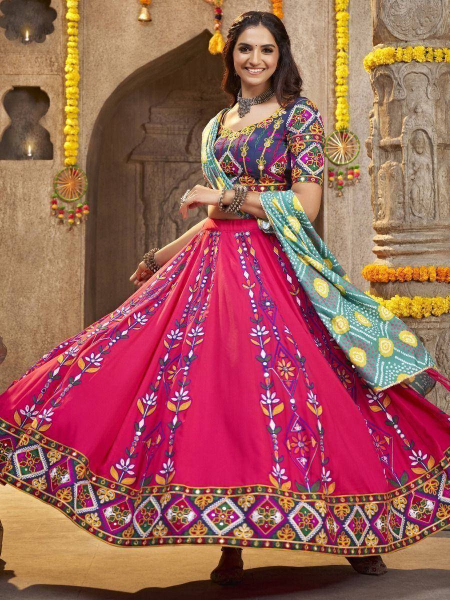 Vibrant pink embroidered lehenga choli with colorful dupatta, perfect for Indian ethnic occasions