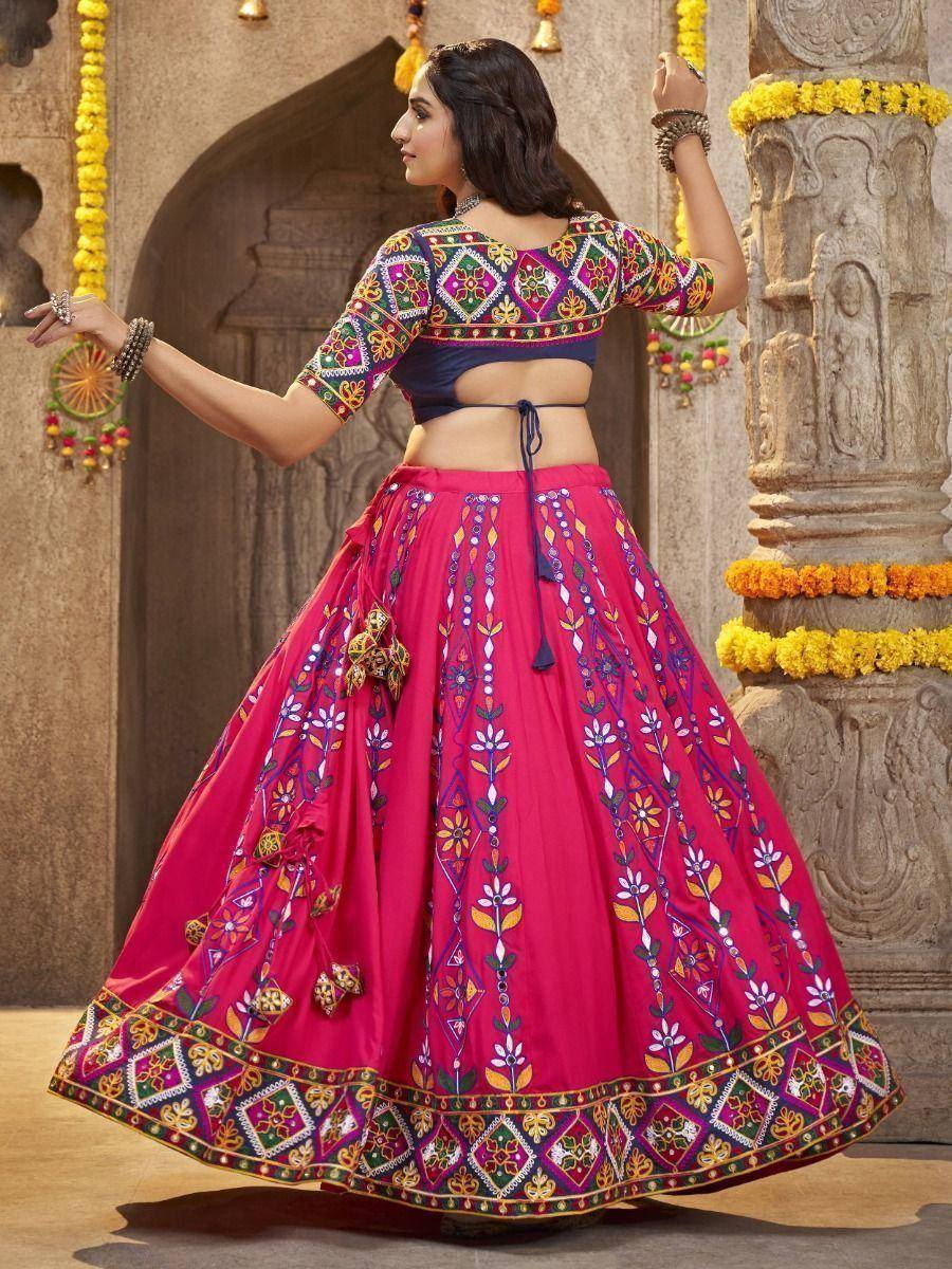 Vibrant pink embroidered lehenga choli with colorful mirror work, perfect for Indian ethnic occasions
