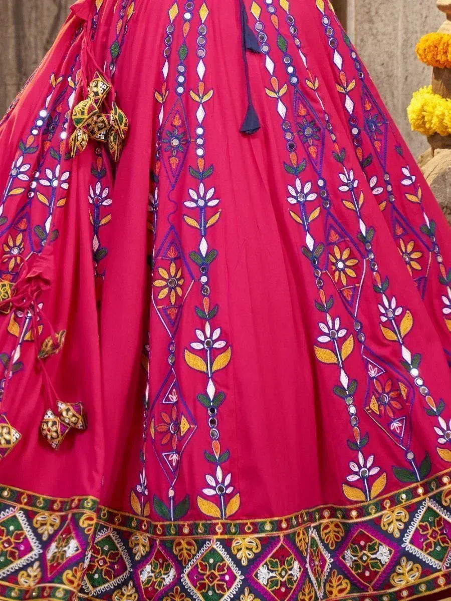 Vibrant pink lehenga with floral mirror embroidery and colorful border, perfect for Indian ethnic wear