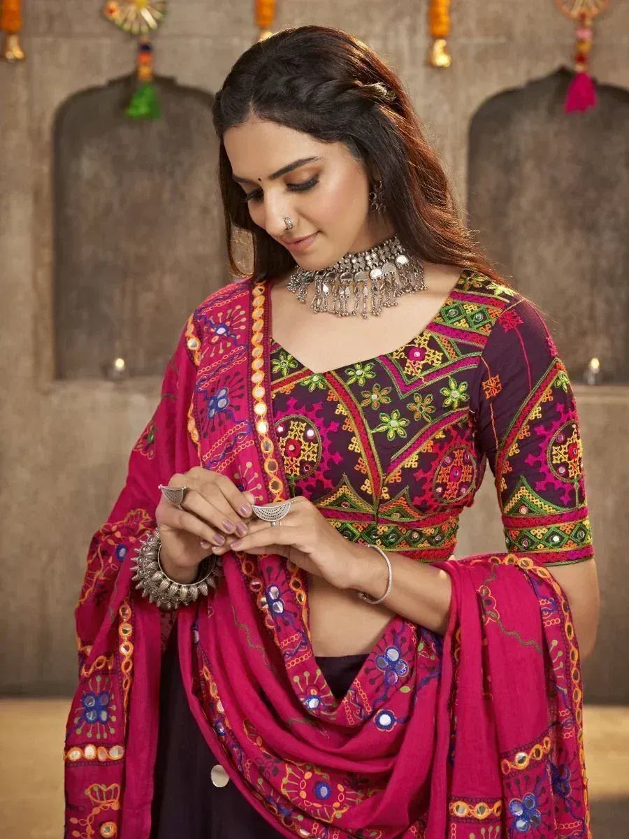 Vibrant pink and purple embroidered ethnic salwar kameez with mirror work and traditional jewelry