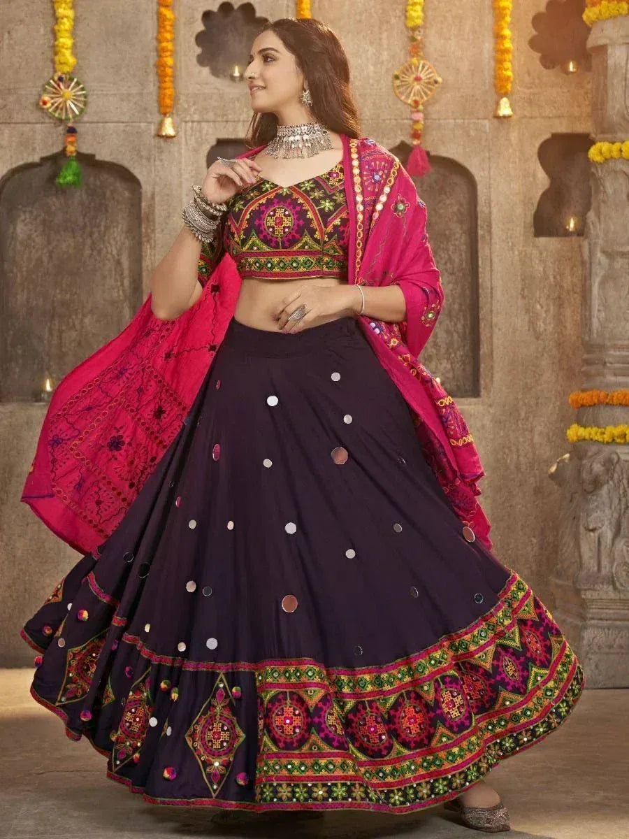Vibrant purple lehenga choli with mirror work and pink dupatta, perfect for Indian ethnic occasions