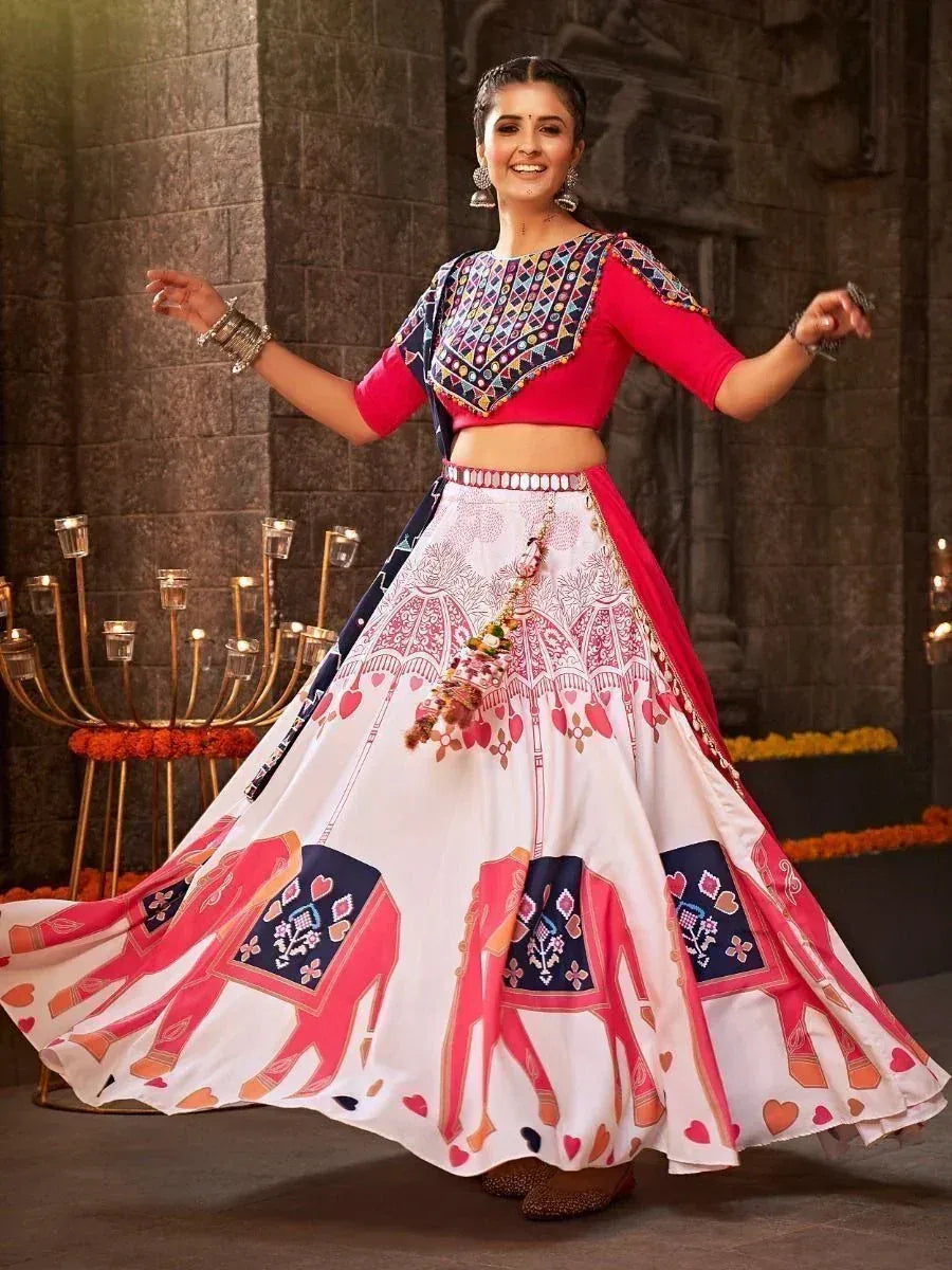 Woman in vibrant pink and white printed lehenga choli with elephant motifs, perfect for festive occasions