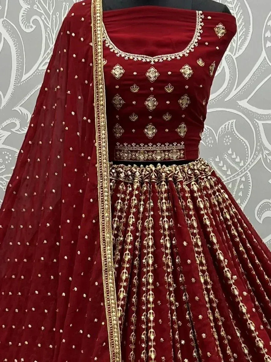 Maroon velvet lehenga choli with gold embroidery and dupatta, Indian ethnic wear for weddings