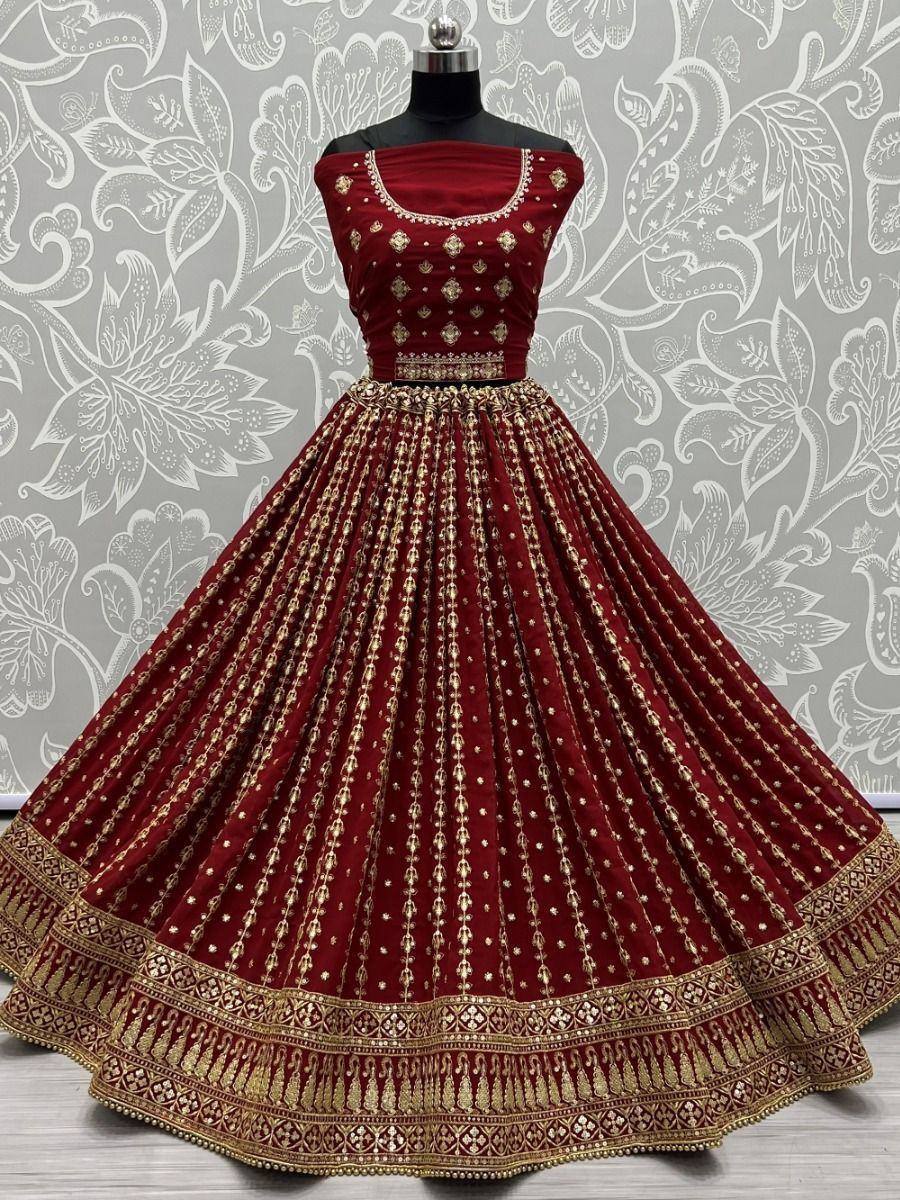 Maroon velvet lehenga choli with gold embroidery, perfect for Indian weddings and festive occasions