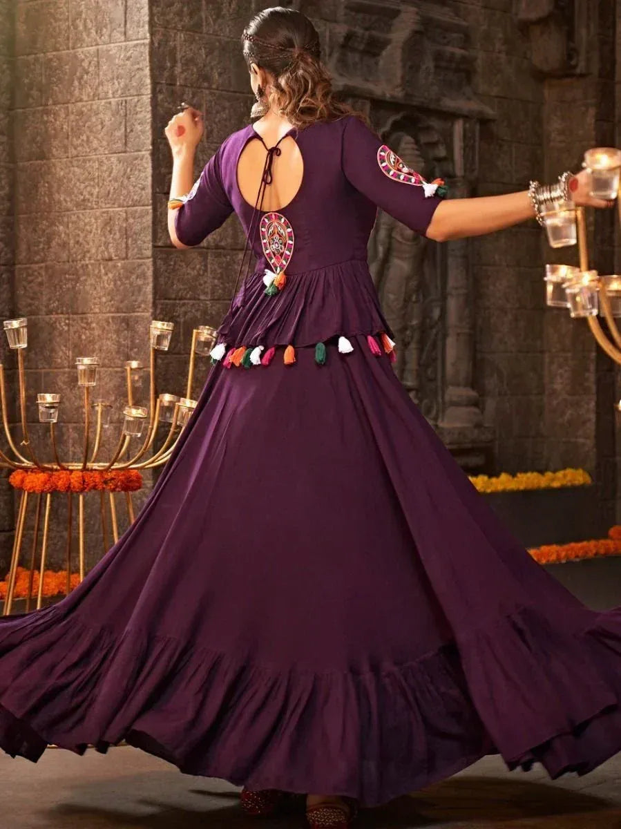Purple ethnic gown with back cutout, embroidery, and tassels, perfect for Indian festive occasions