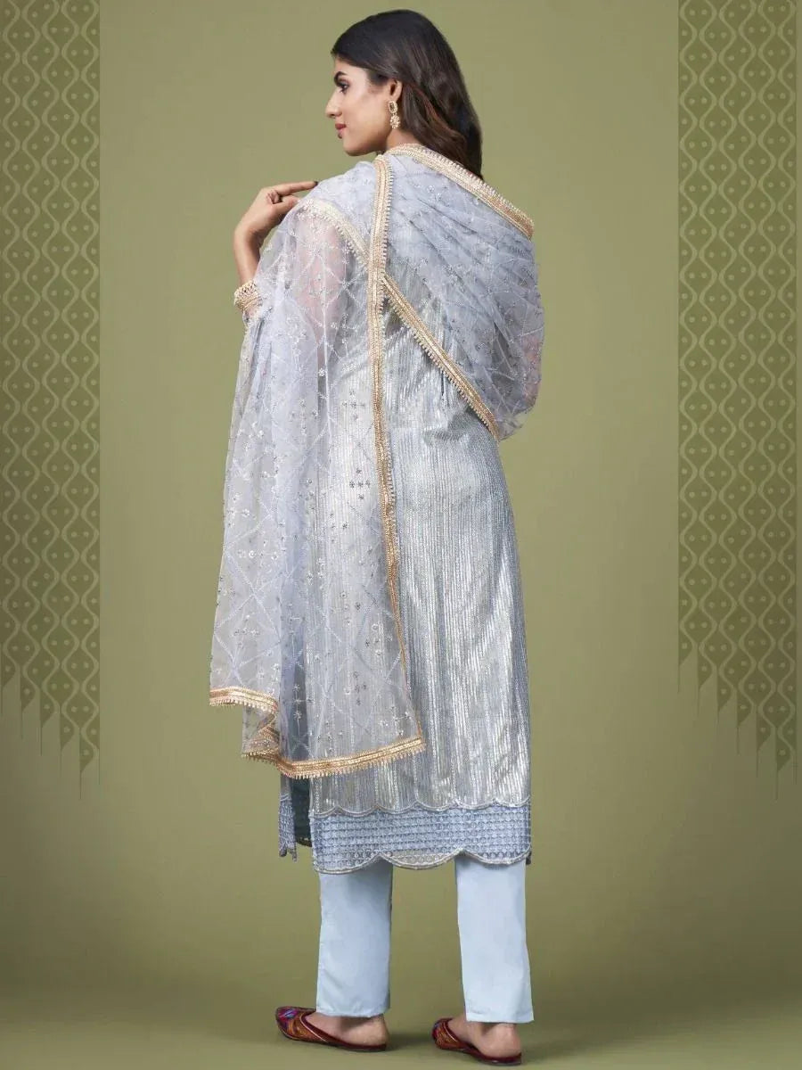 Light blue embroidered salwar kameez with sheer dupatta, gold trim, and scalloped hem for ethnic wear