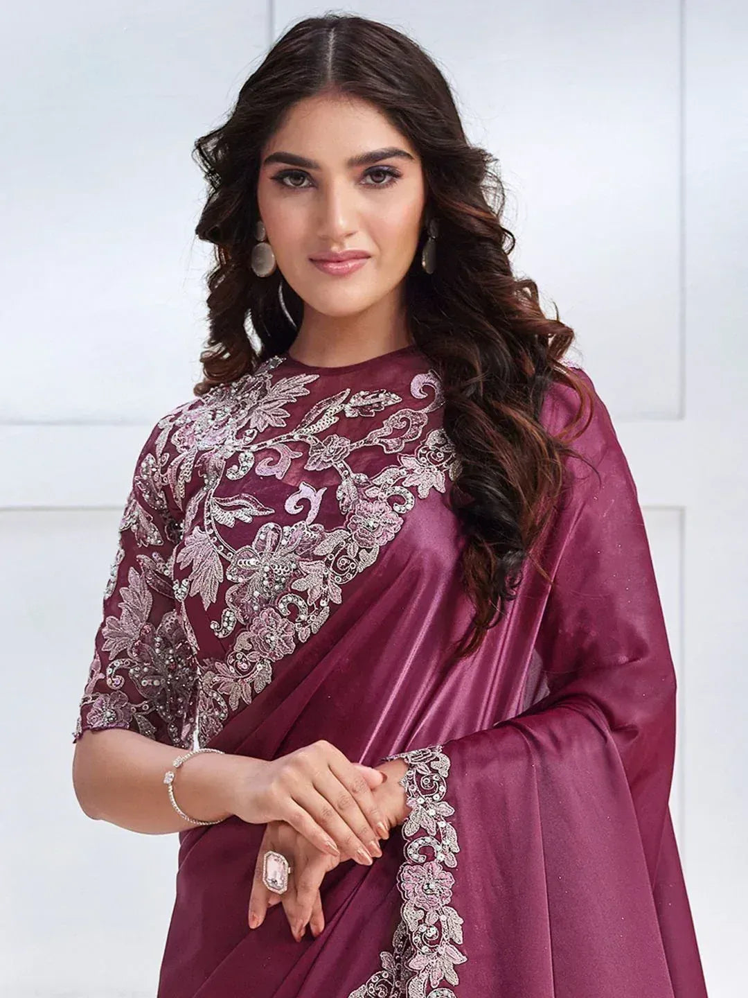 Elegant maroon saree with silver floral embroidery, perfect for Indian ethnic occasions