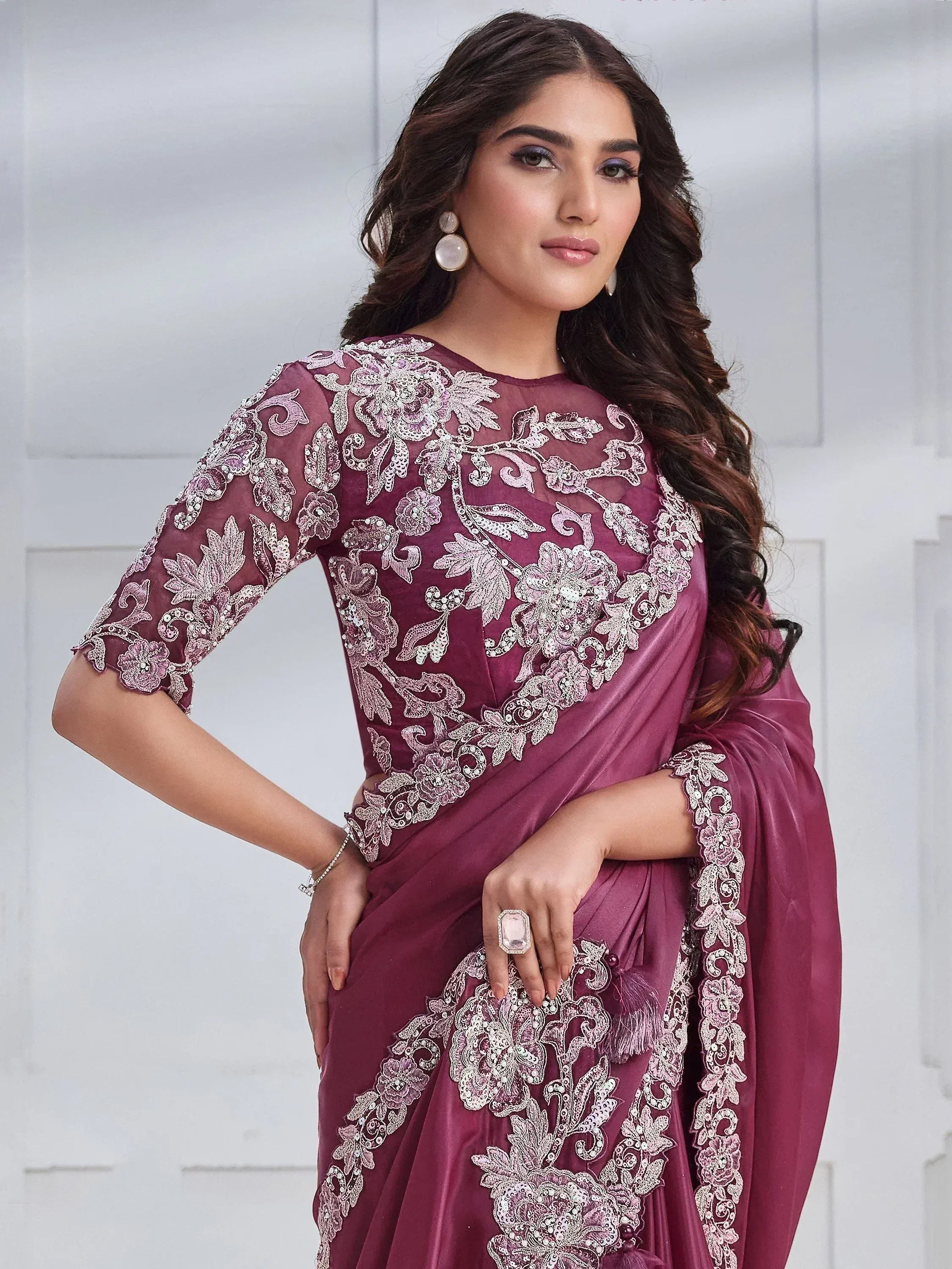 Elegant maroon saree with intricate floral embroidery and sequin work, perfect for Indian ethnic occasions.