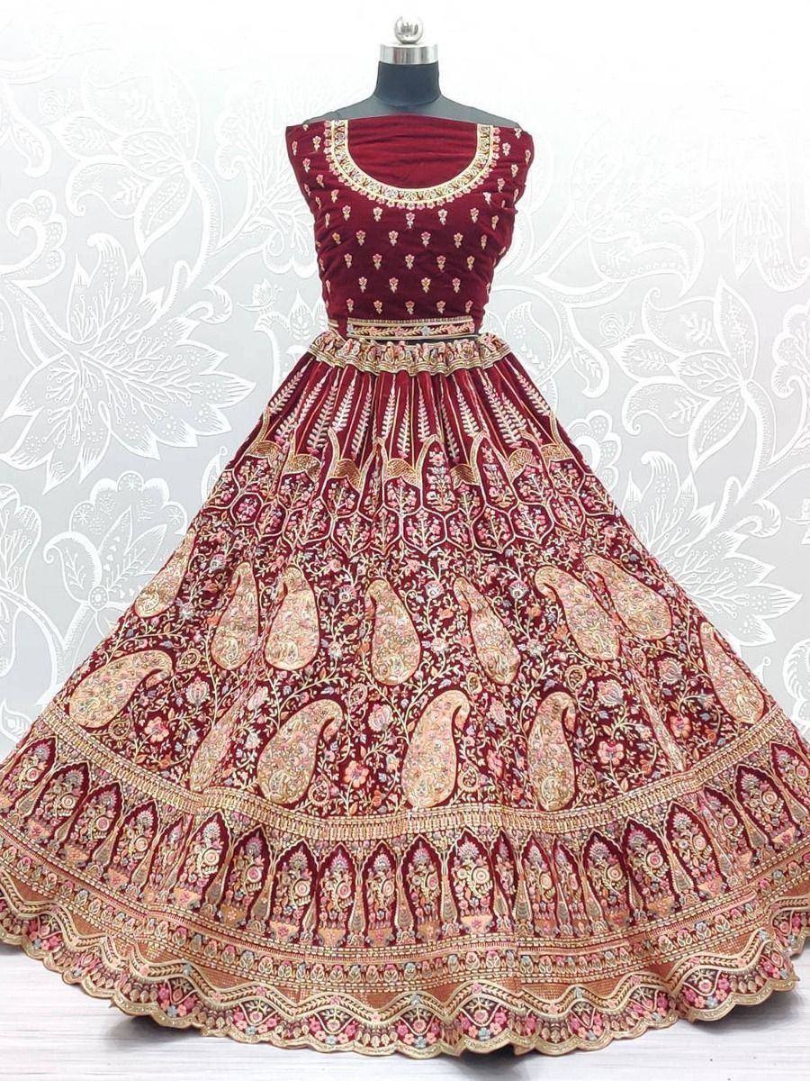 Maroon velvet lehenga choli with gold paisley embroidery, perfect for Indian weddings and festive occasions
