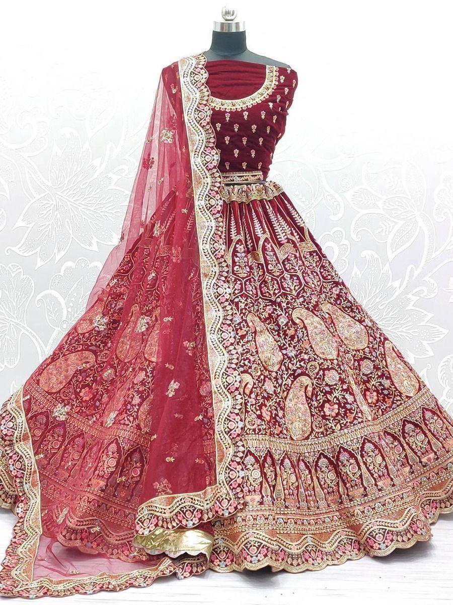 Maroon designer lehenga choli with gold embroidery and matching dupatta, ideal for weddings and festive occasions