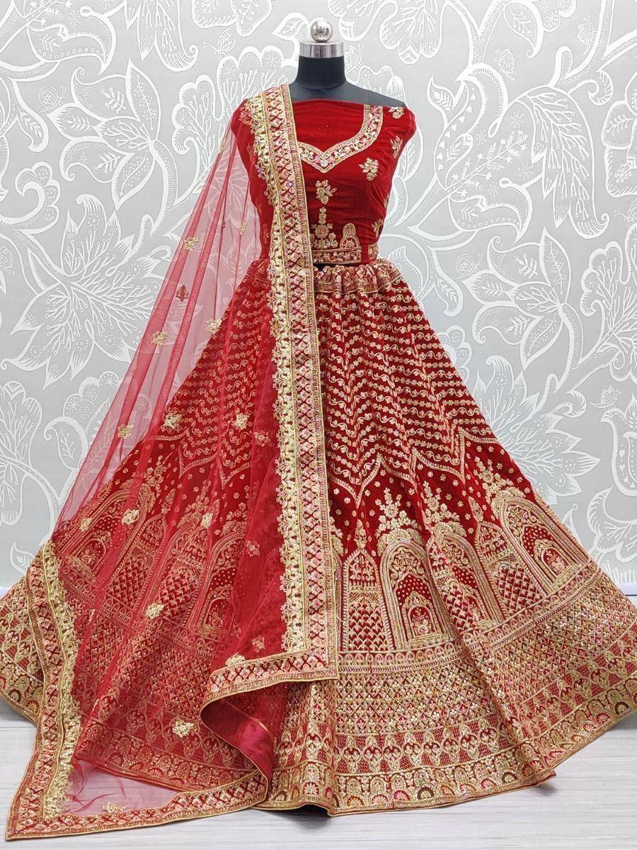 Red velvet designer lehenga choli with gold embroidery and sheer dupatta, perfect for weddings and festivals