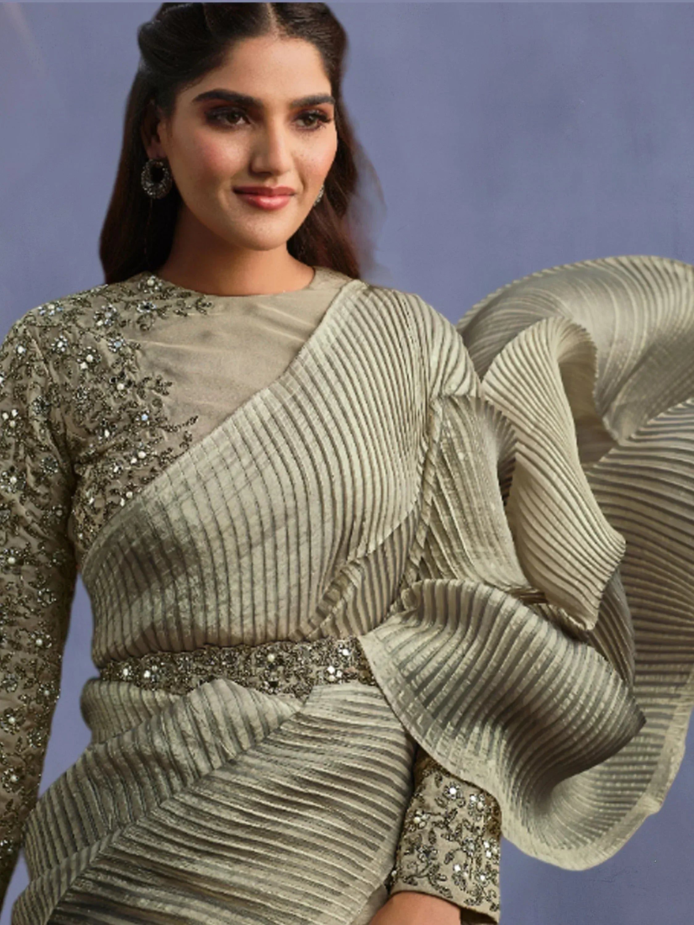Elegant Indian ethnic gown with pleated sleeves, sequin embroidery, and embellished waistband for festive occasions.
