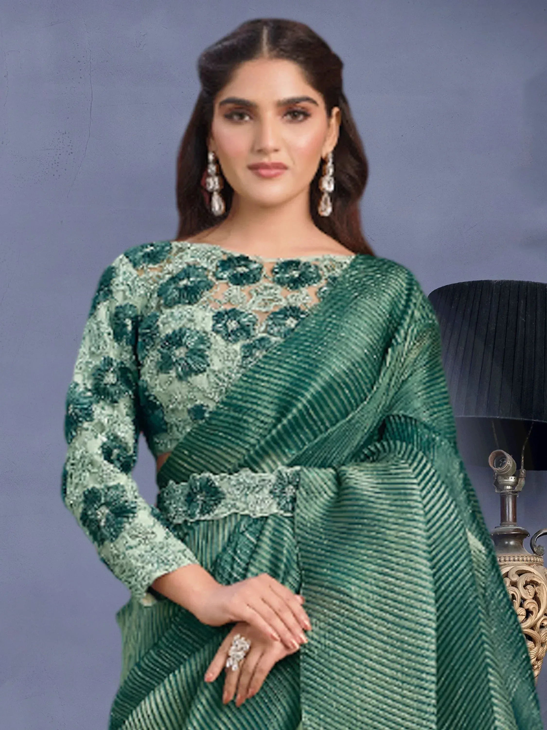 Emerald green designer saree with floral embroidery and sequin work, perfect for Indian ethnic occasions.