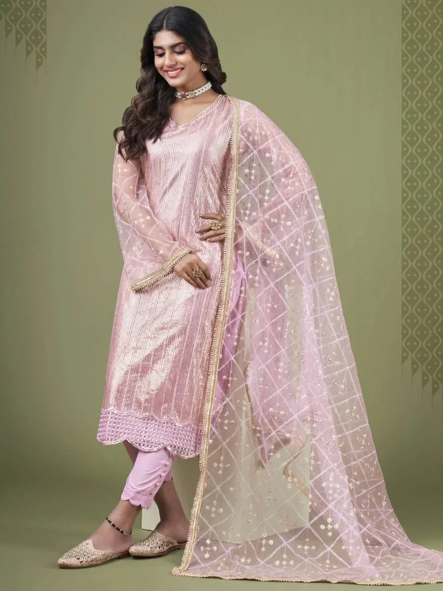 Woman wearing a light pink embroidered salwar kameez with matching dupatta, ethnic wear