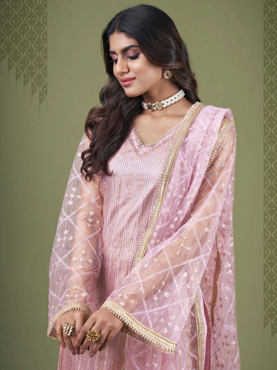 Pink embroidered salwar kameez with gold detailing, perfect for ethnic occasions