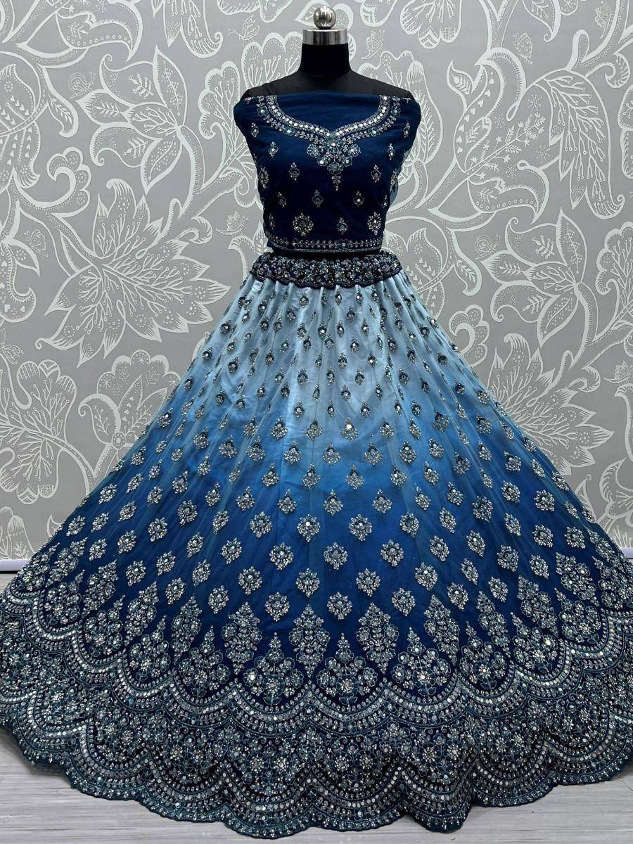 Blue ombre lehenga choli with heavy stone embroidery, perfect for Indian weddings and festive occasions.