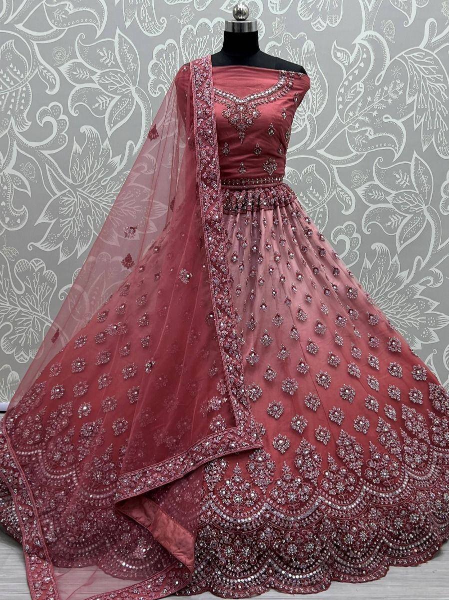 Dusty rose designer lehenga choli with heavy embroidery and sheer dupatta, perfect for weddings and festivals