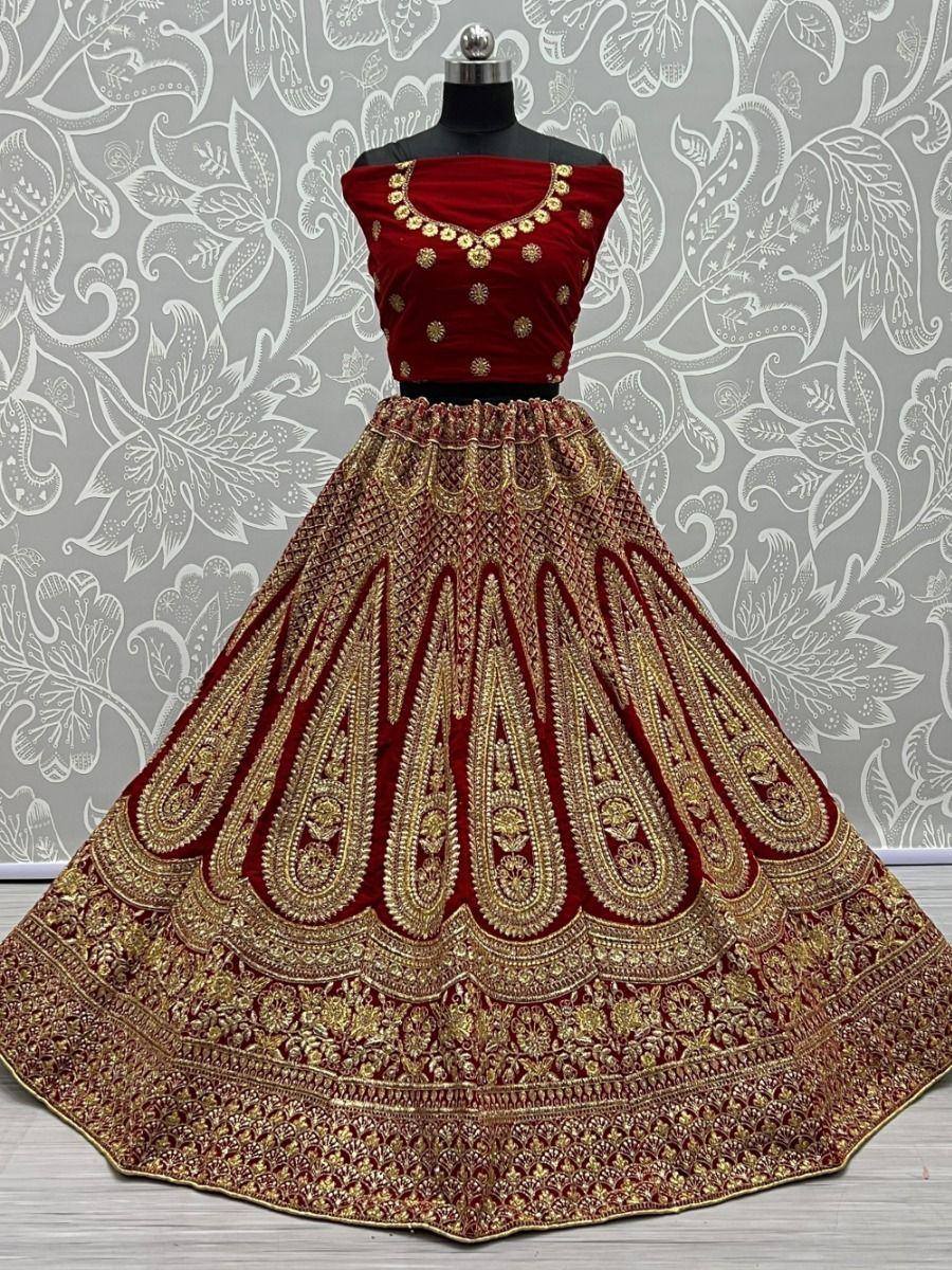 Red velvet lehenga choli with gold embroidery, designer ethnic wear for weddings