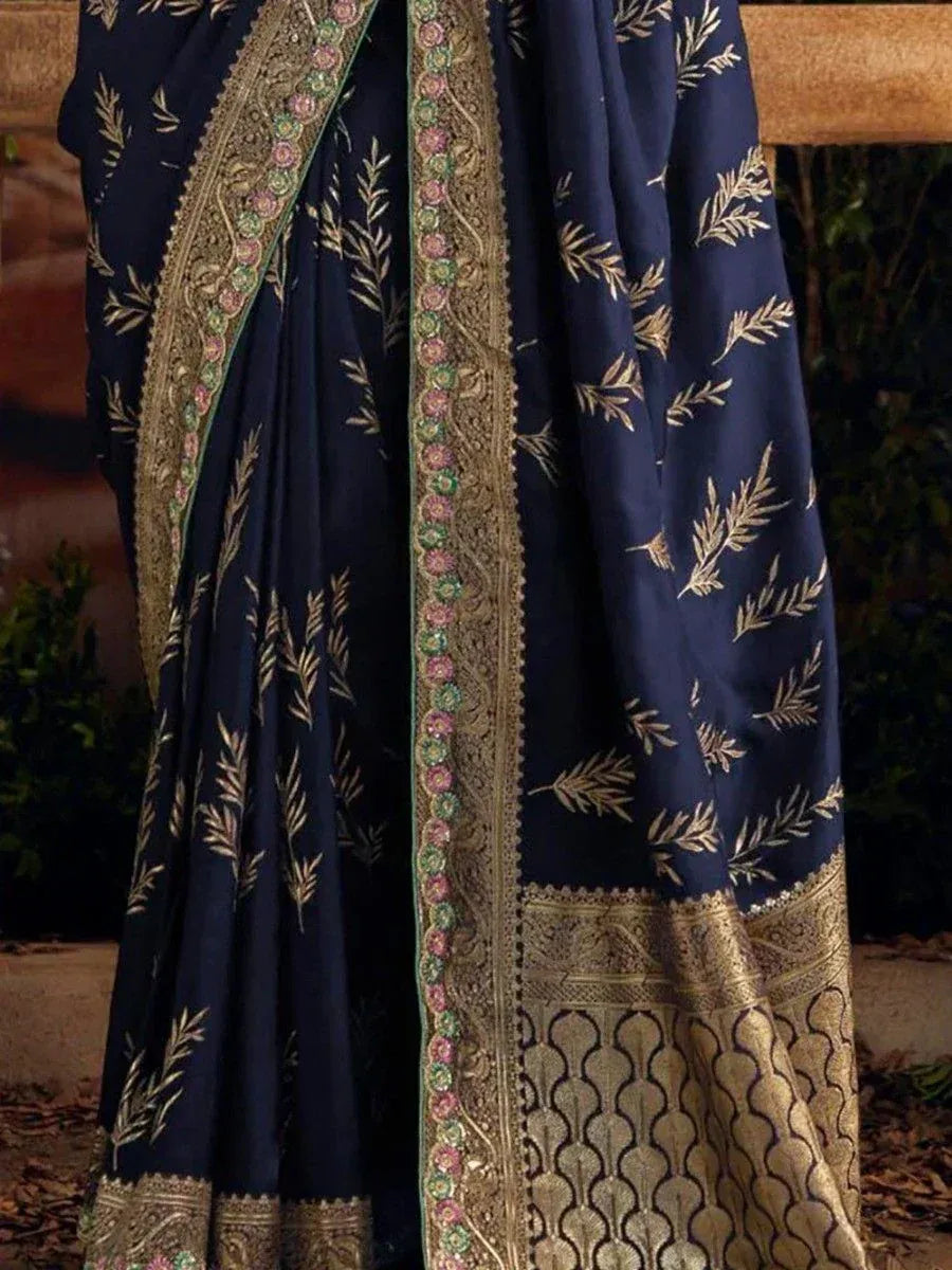 Navy blue saree with gold leaf embroidery and floral border, elegant Indian ethnic wear