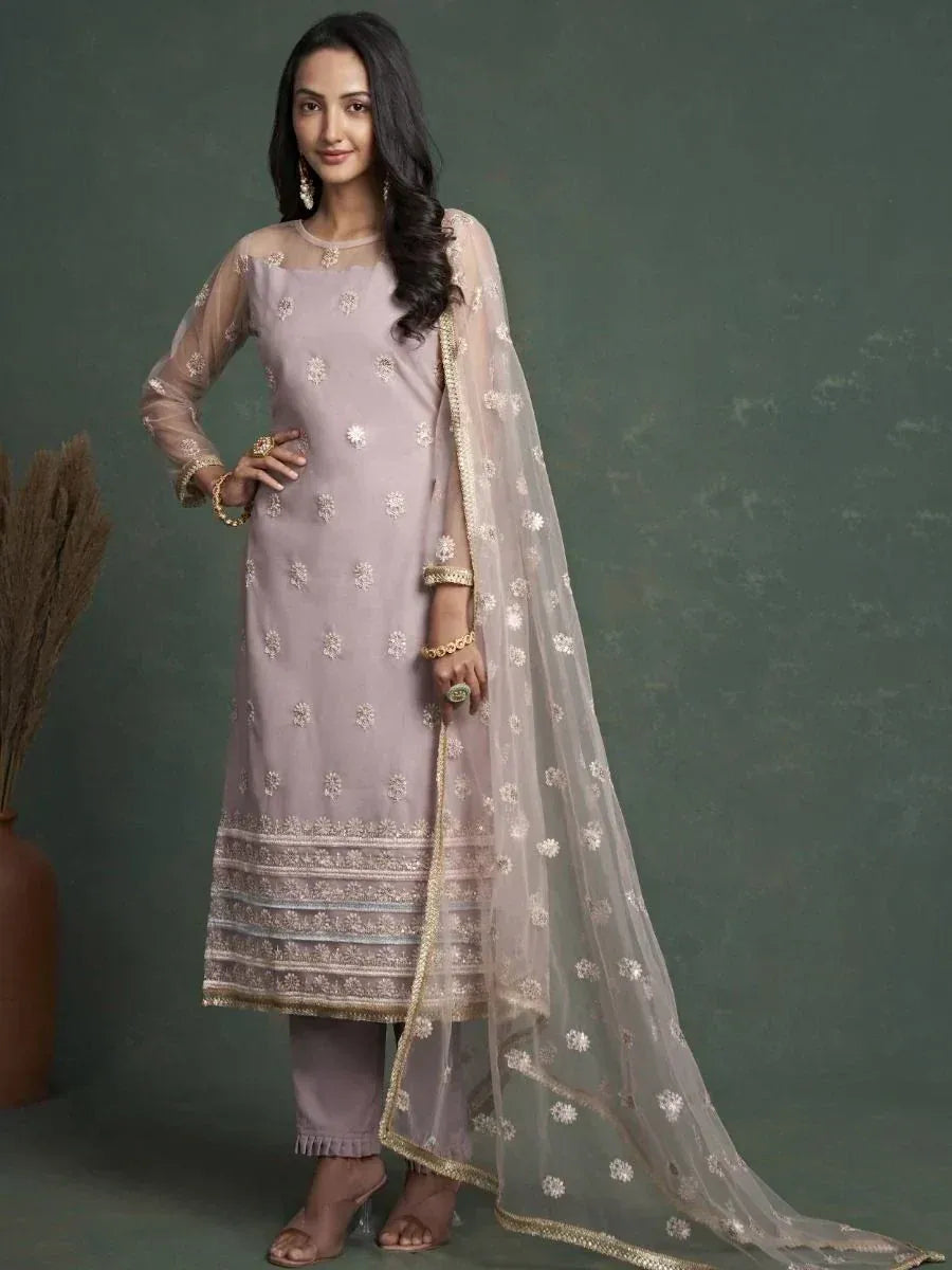 Elegant lavender ethnic salwar kameez with floral embroidery and sheer dupatta, perfect for festive occasions.