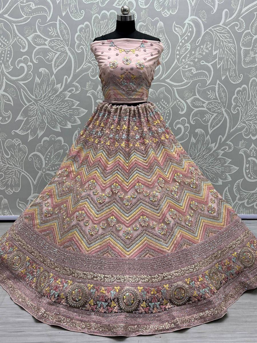 Pink designer lehenga choli with zigzag embroidery and floral embellishments for Indian ethnic wear