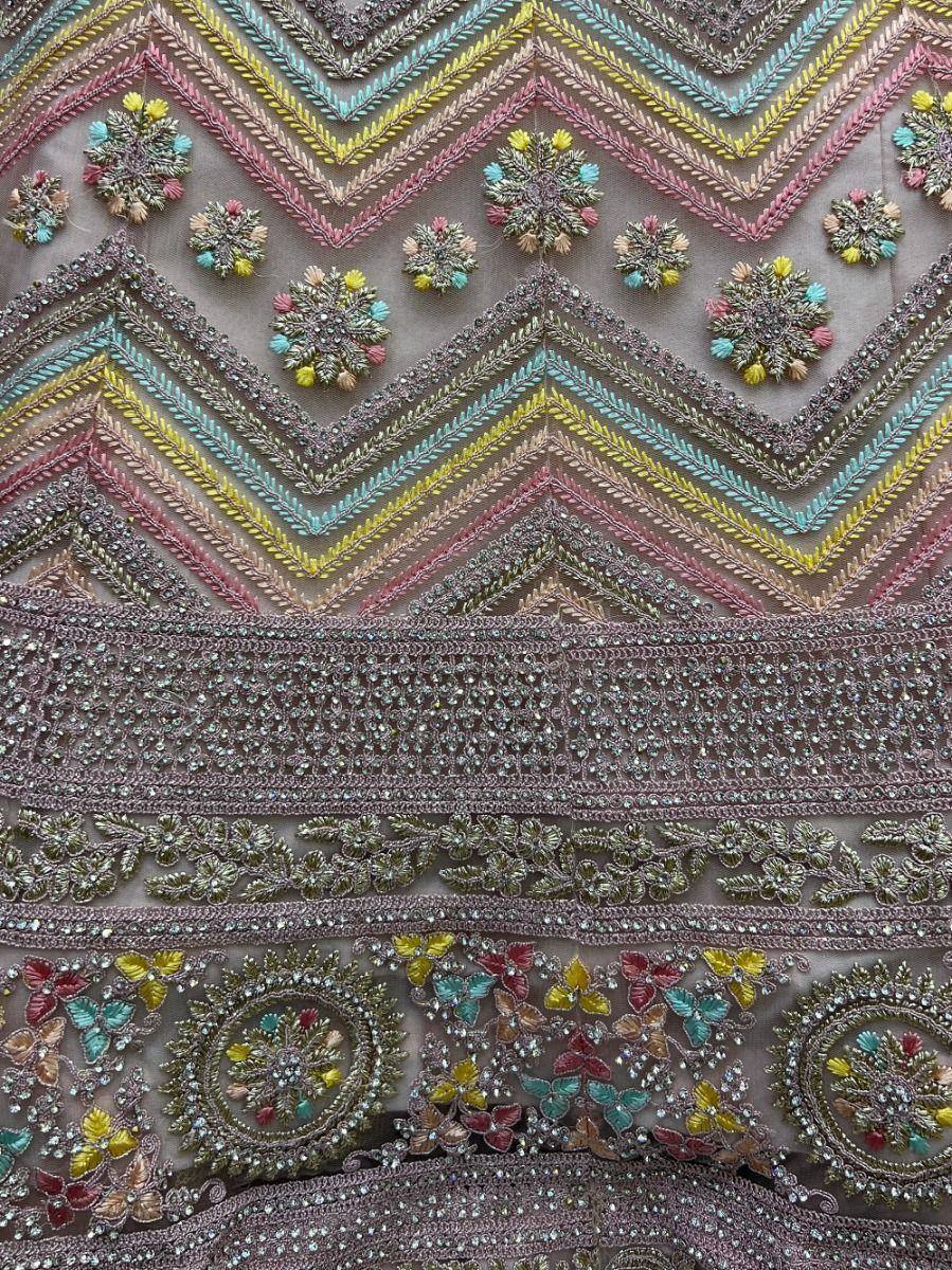 Colorful embroidered ethnic wear with floral and chevron patterns, perfect for designer lehenga or saree