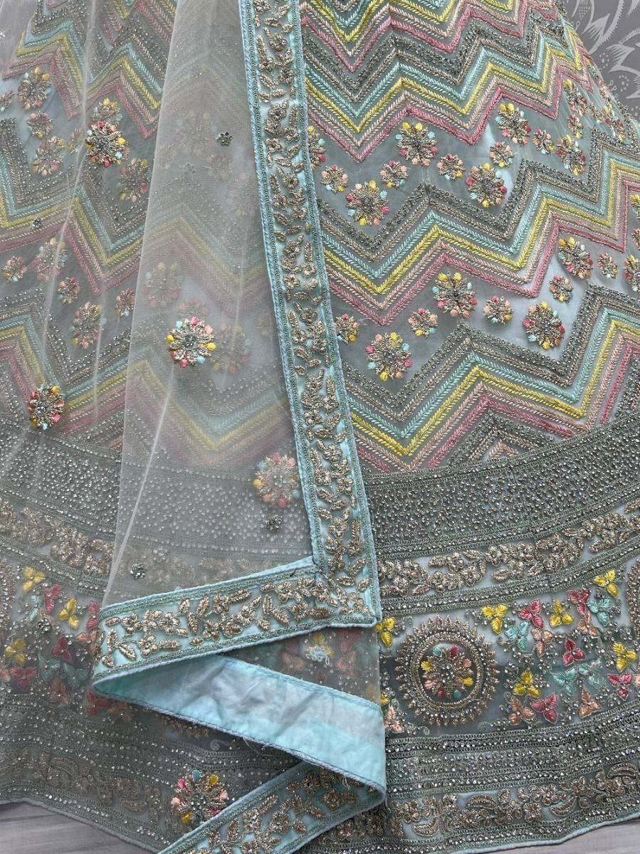 Designer lehenga choli with colorful zigzag embroidery and floral motifs, perfect for Indian ethnic wear
