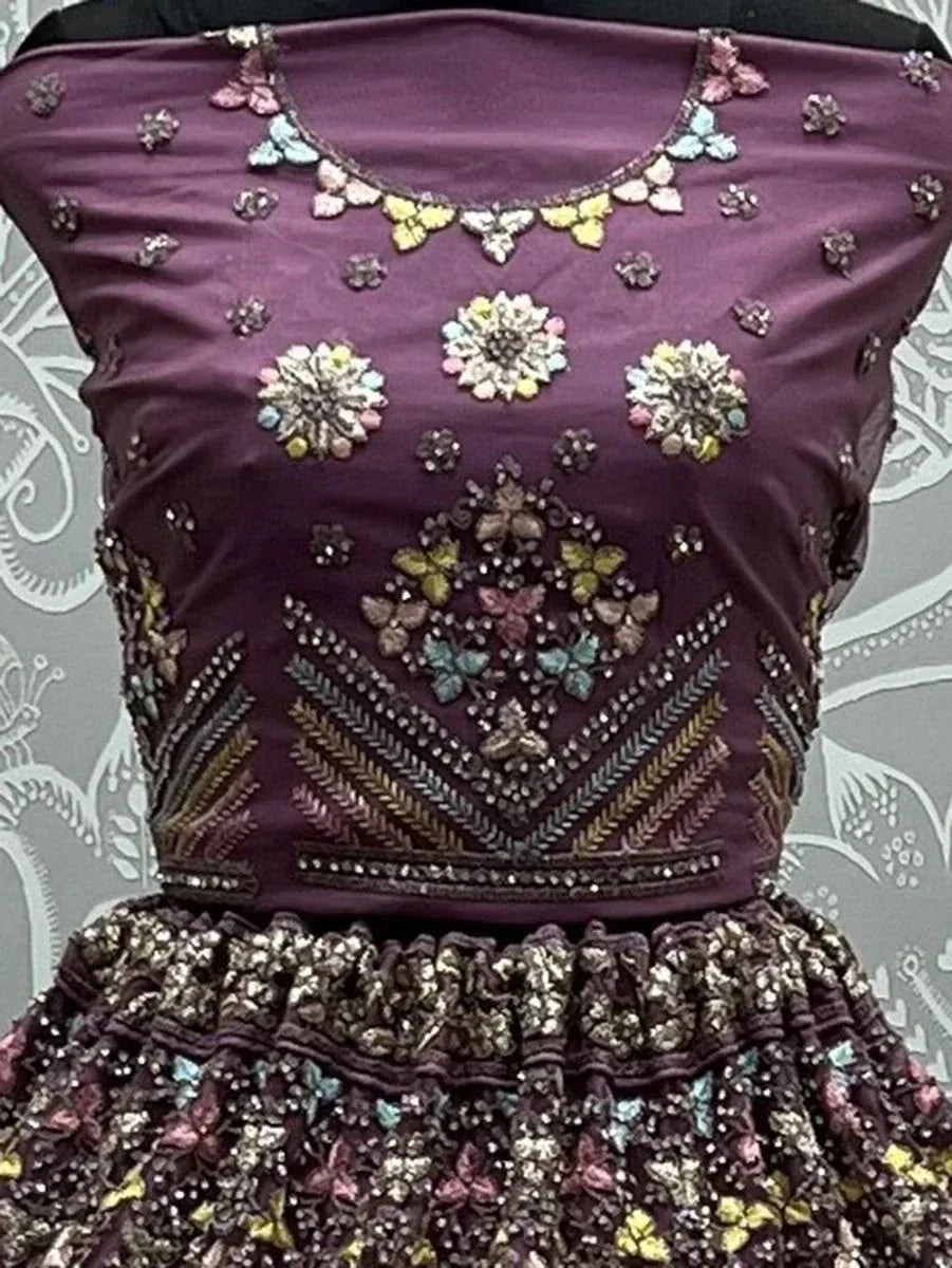 Purple designer lehenga choli with floral embroidery and butterfly motifs, perfect for Indian ethnic wear.