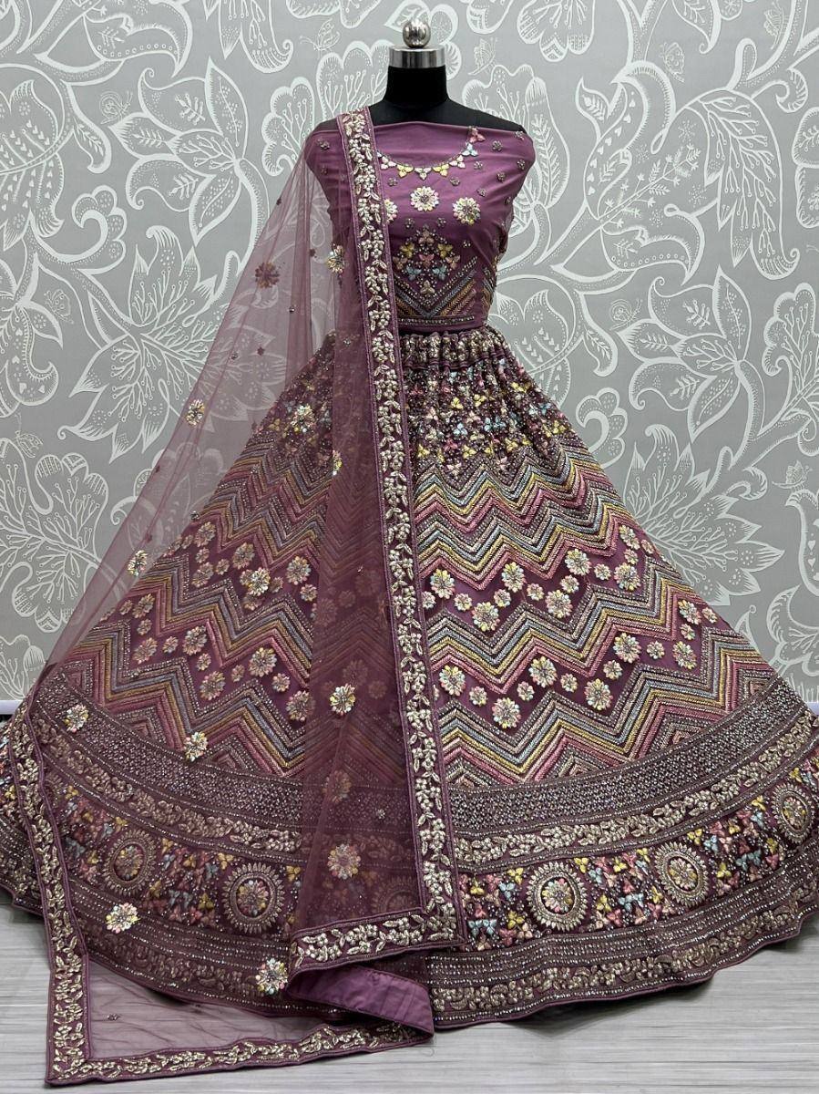 Purple designer lehenga choli with intricate floral embroidery and zigzag patterns, perfect for weddings