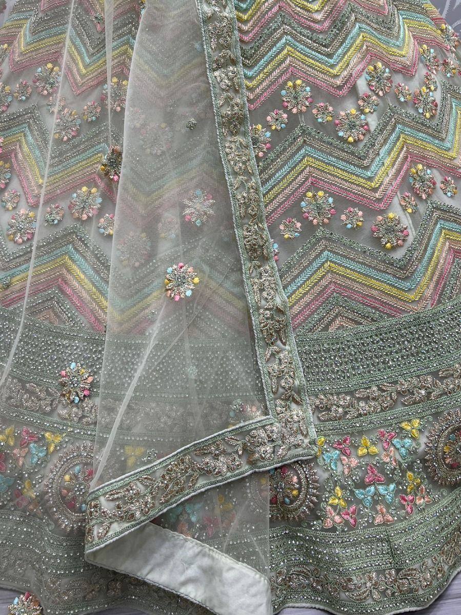 Pastel embroidered lehenga with zigzag patterns and floral motifs, ideal for Indian ethnic wear