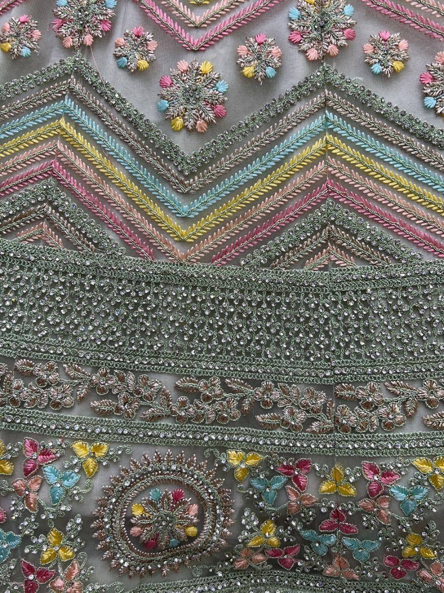 Colorful embroidered Indian ethnic wear with floral and geometric patterns, sequins, and threadwork details.