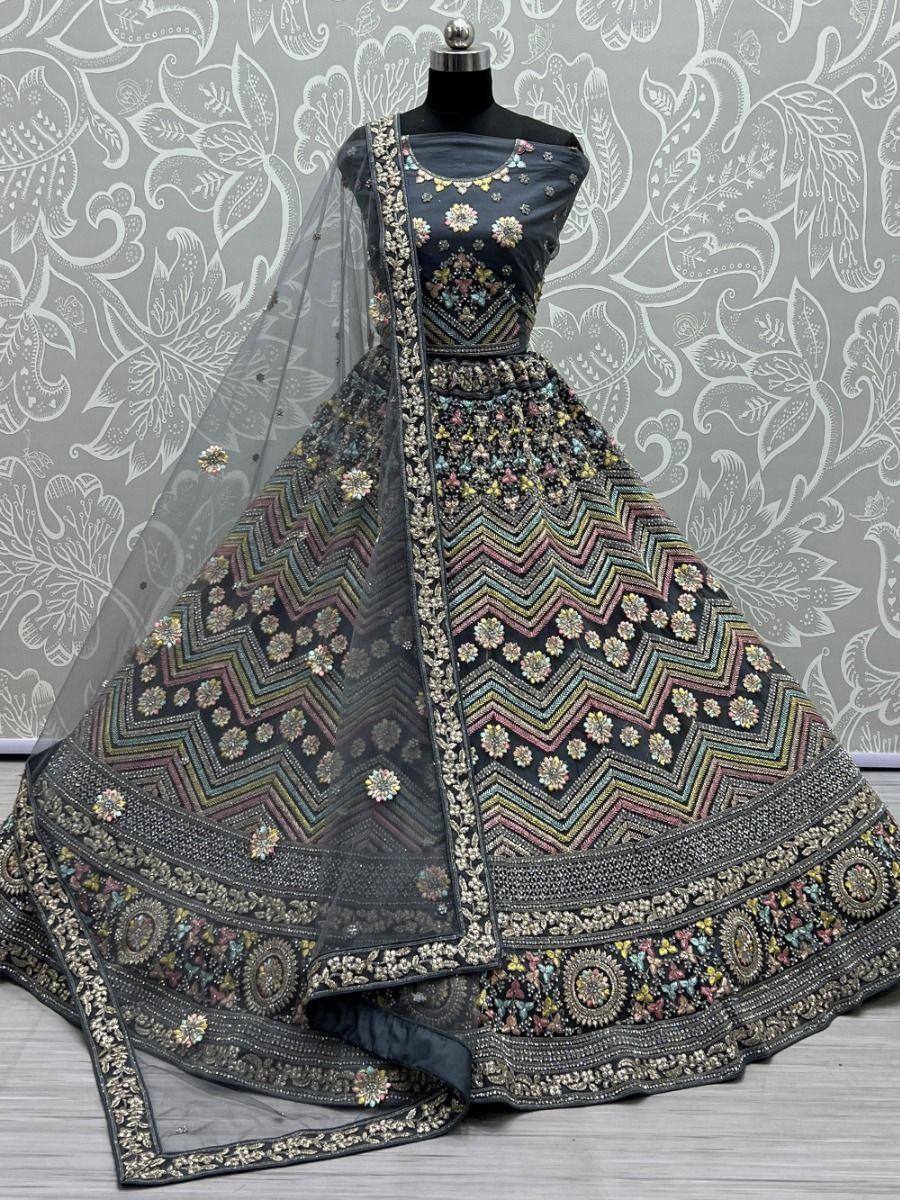 Black embroidered lehenga choli with colorful zigzag patterns and floral motifs, perfect for Indian ethnic wear