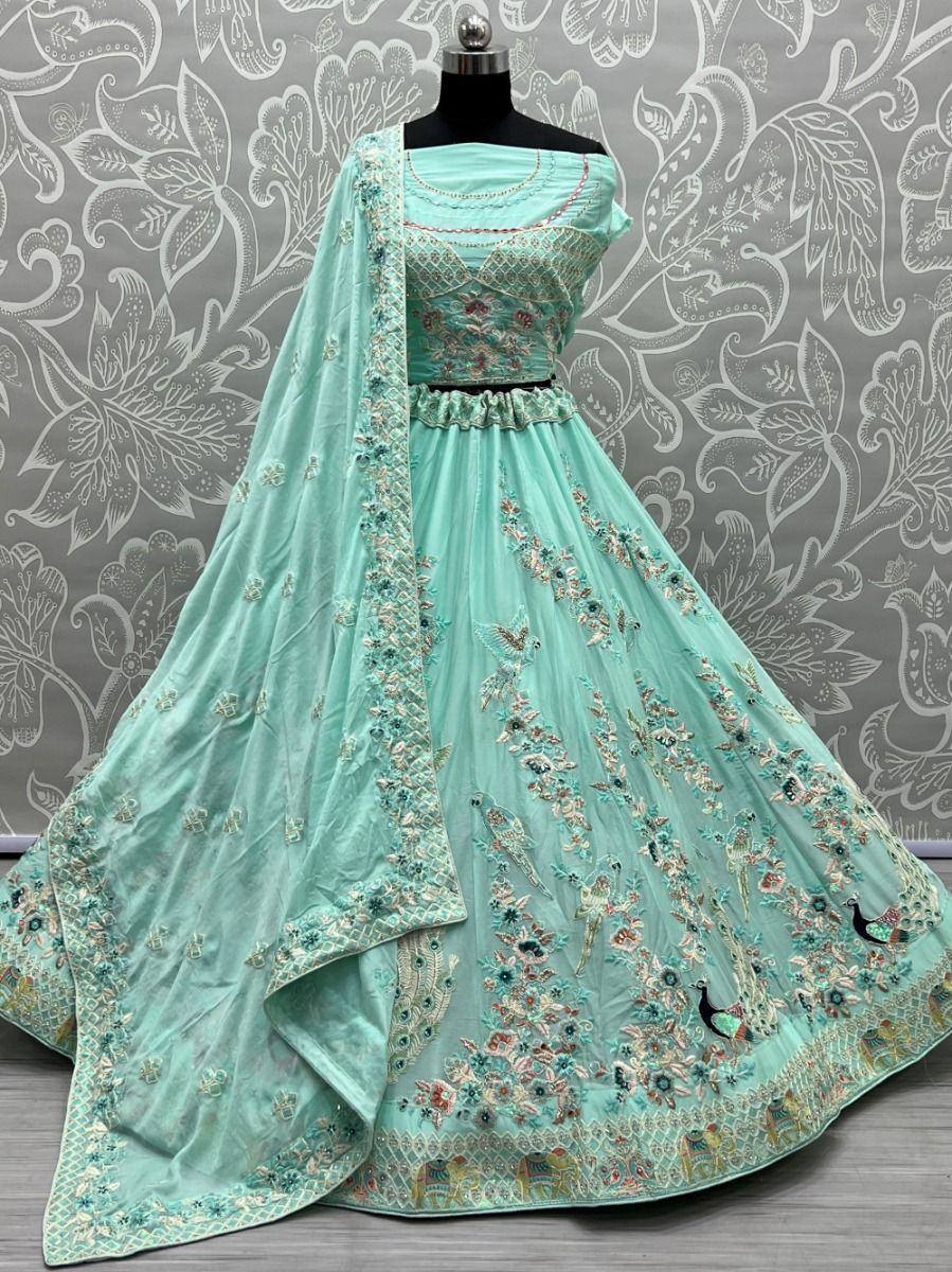 Mint green embroidered lehenga choli with peacock motifs, perfect for Indian ethnic wear events