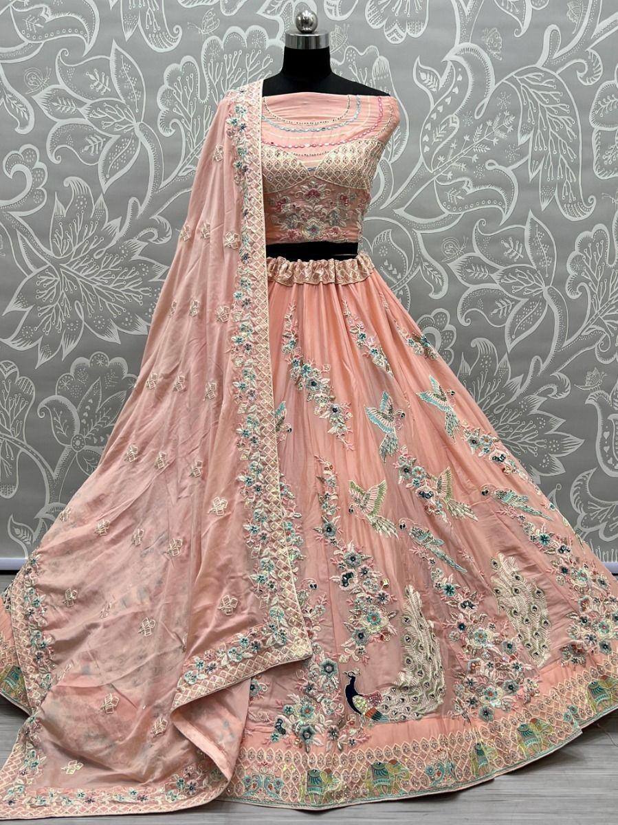 Pink embroidered lehenga choli with peacock motifs, perfect for Indian ethnic wear and weddings