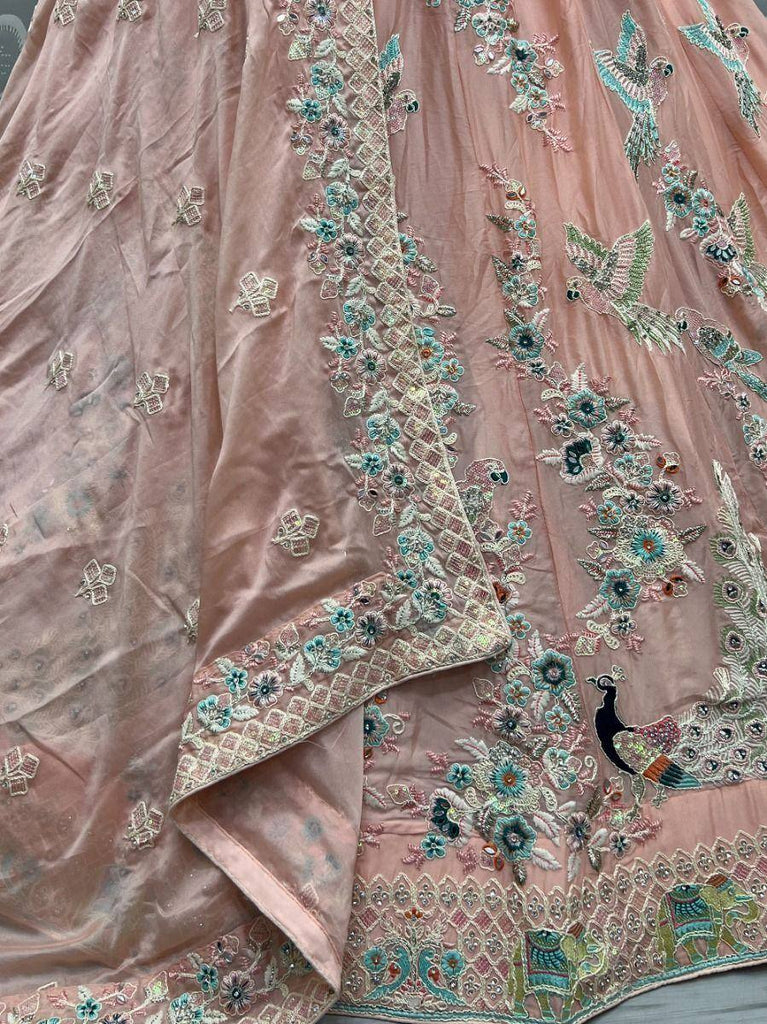 Pink embroidered lehenga with peacock and floral motifs, perfect for Indian ethnic wear occasions