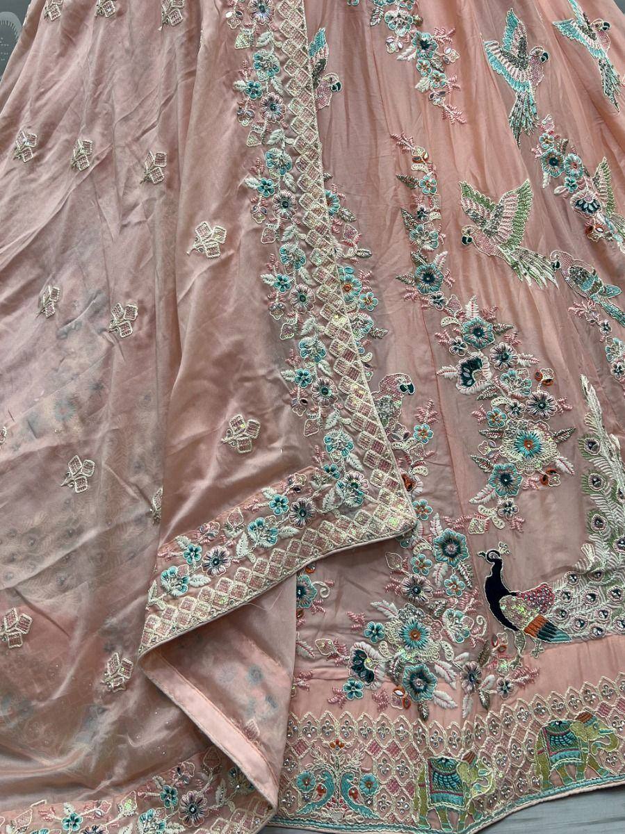 Pink embroidered lehenga with peacock and floral motifs, perfect for Indian ethnic wear occasions