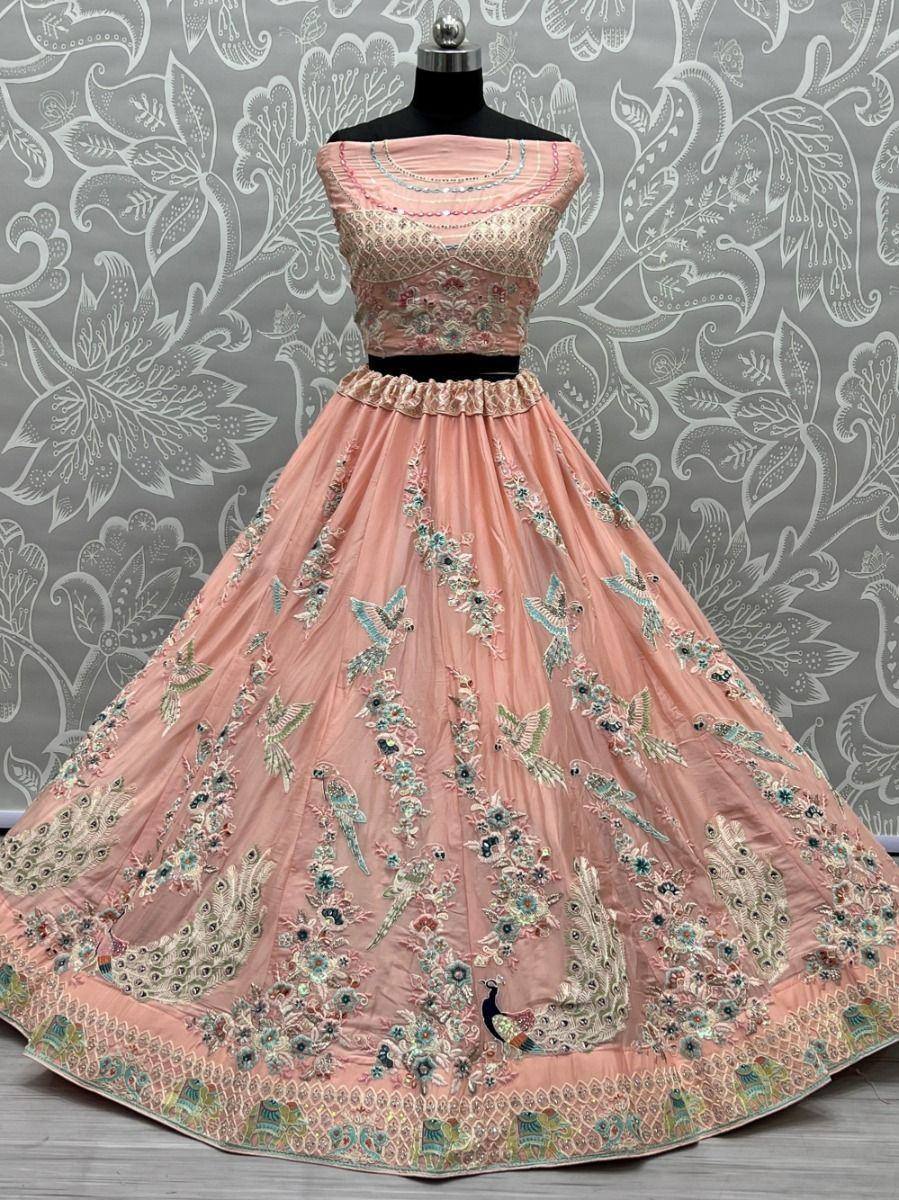 Pink embroidered lehenga choli with peacock motifs, perfect for Indian ethnic wear and festive occasions.