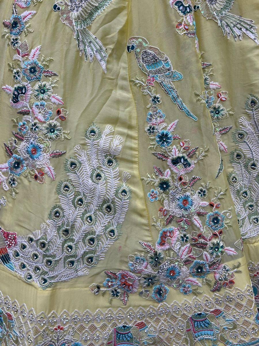 Lemon yellow lehenga with peacock and floral embroidery, perfect for Indian ethnic wear