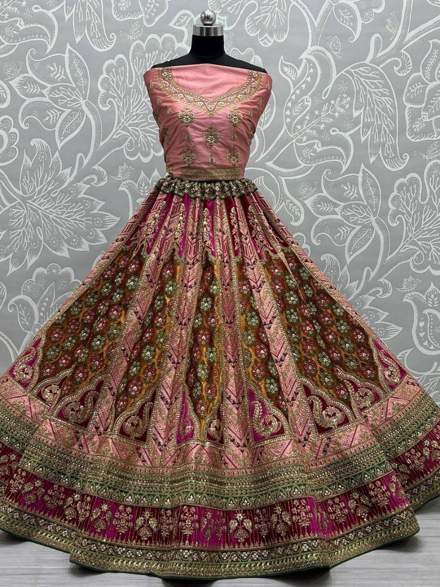 Pink and gold embroidered lehenga choli with floral patterns, perfect for Indian ethnic wear events