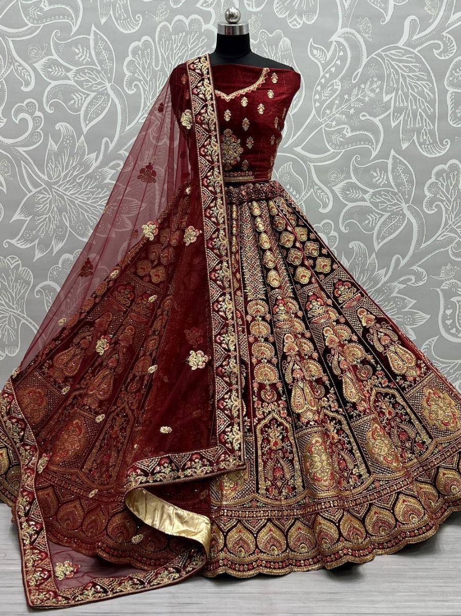Maroon designer lehenga choli with gold embroidery and sheer dupatta, ethnic Indian wear