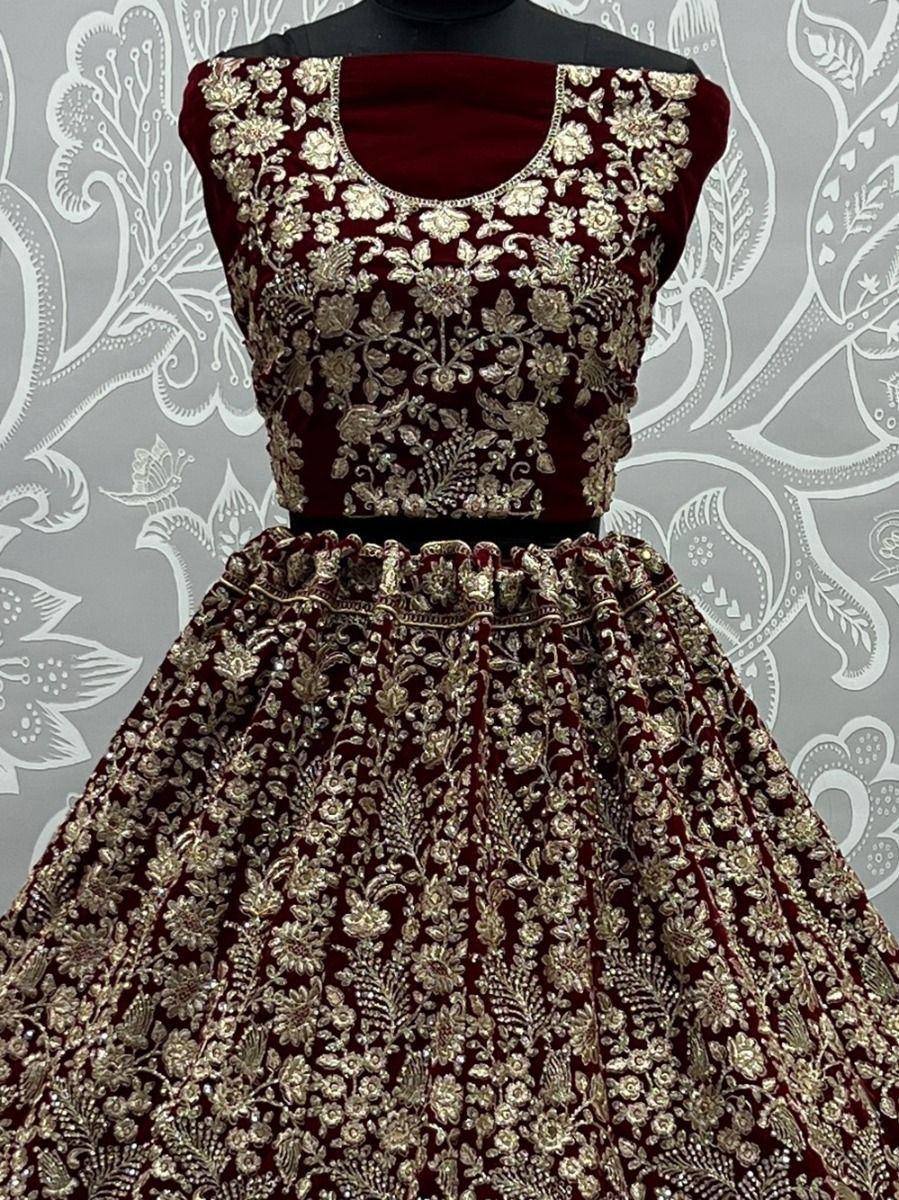 Maroon velvet lehenga choli with gold floral embroidery, ethnic Indian wedding wear