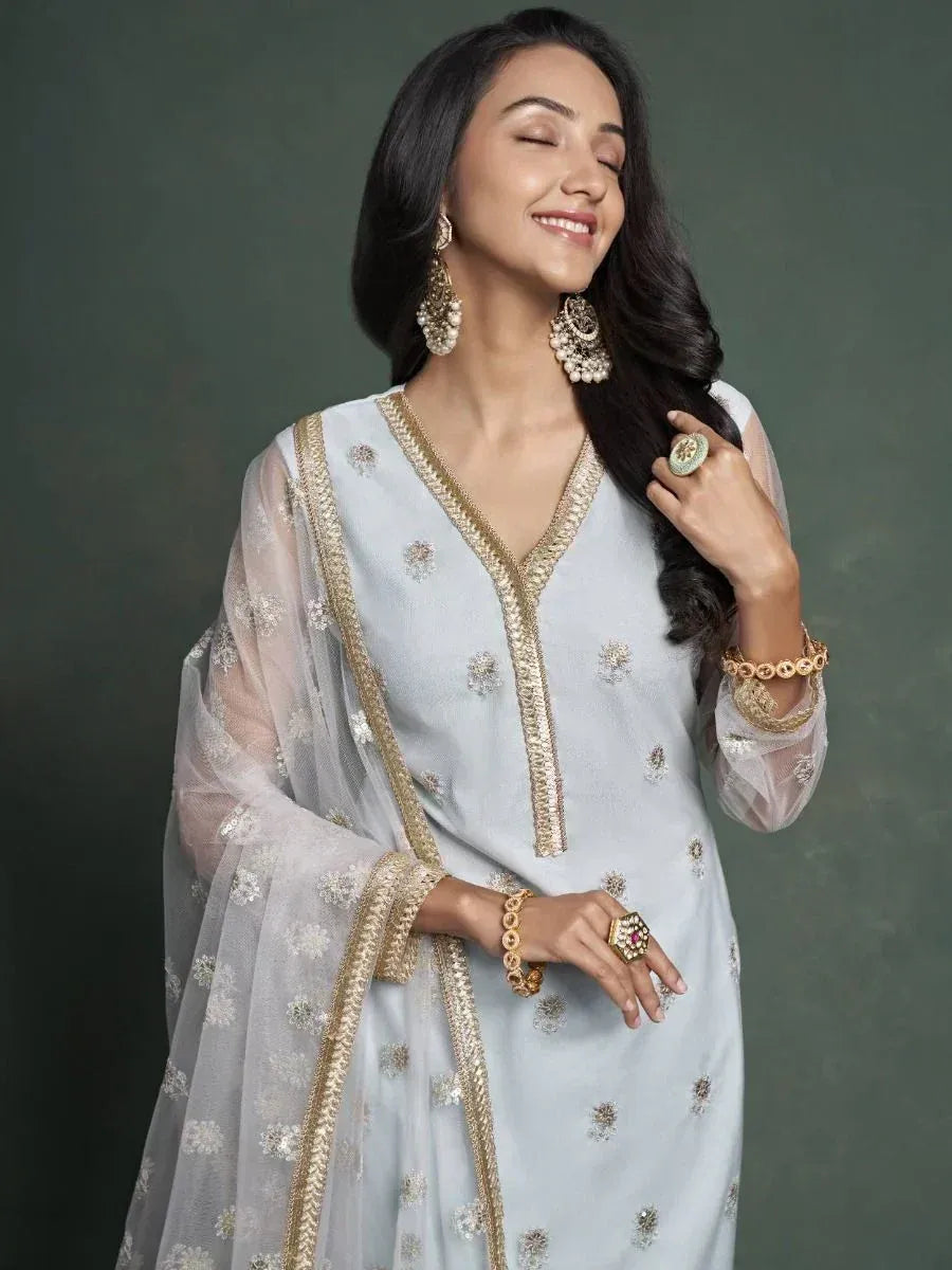Elegant light blue embroidered salwar kameez with gold detailing, perfect for Indian ethnic wear occasions