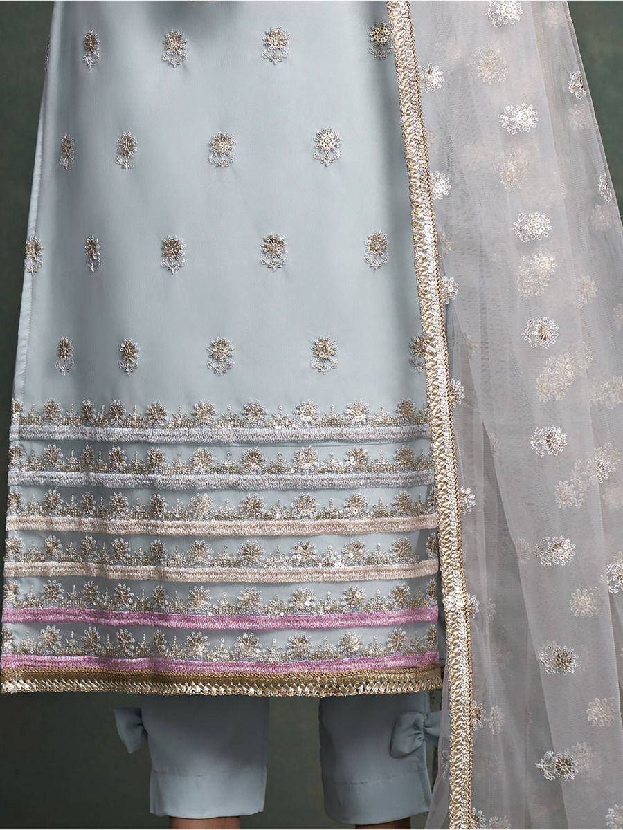 Light blue embroidered salwar kameez with gold detailing and sheer dupatta, perfect for ethnic occasions.