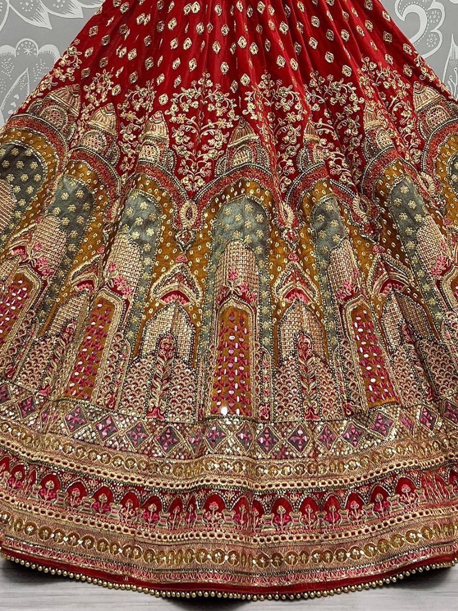 Red velvet lehenga with gold embroidery and mirror work, ethnic Indian bridal wear