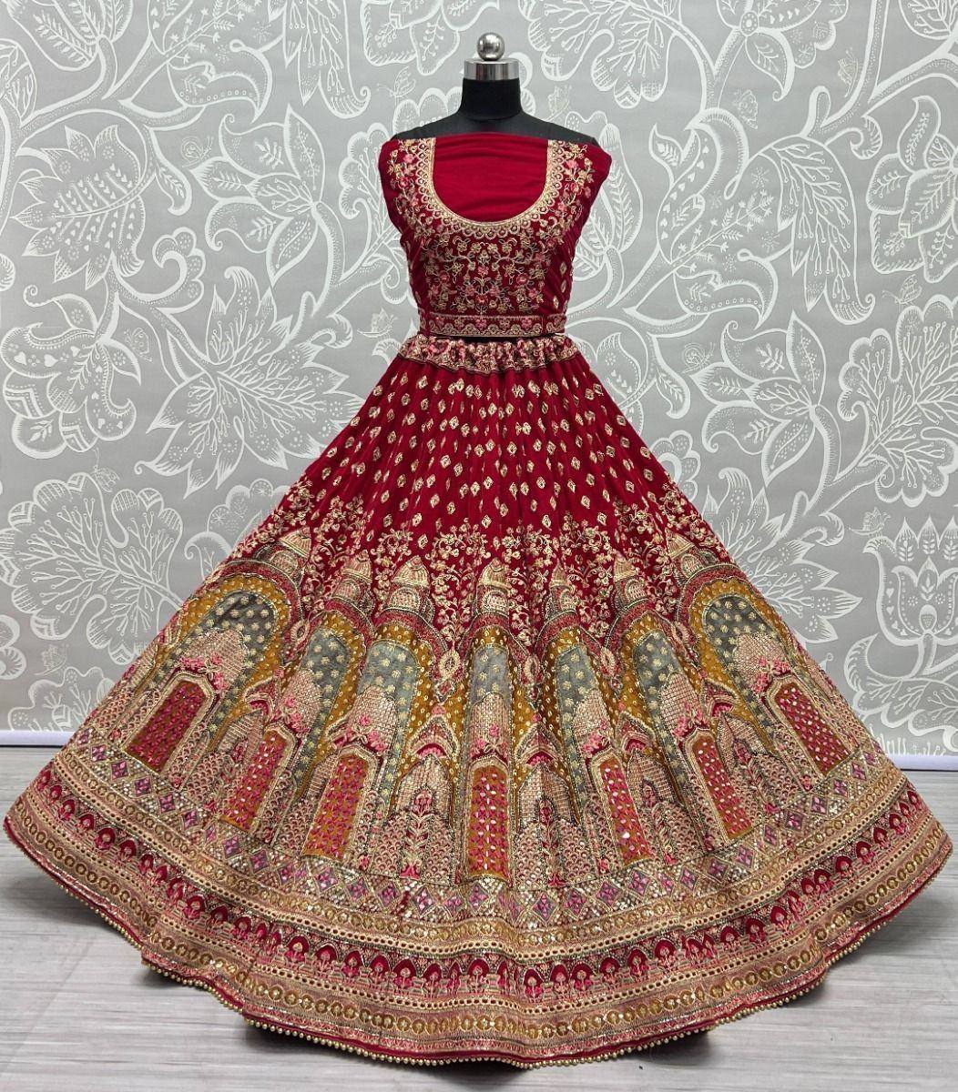 Red designer lehenga choli with intricate gold embroidery and temple motifs, perfect for Indian ethnic wear.
