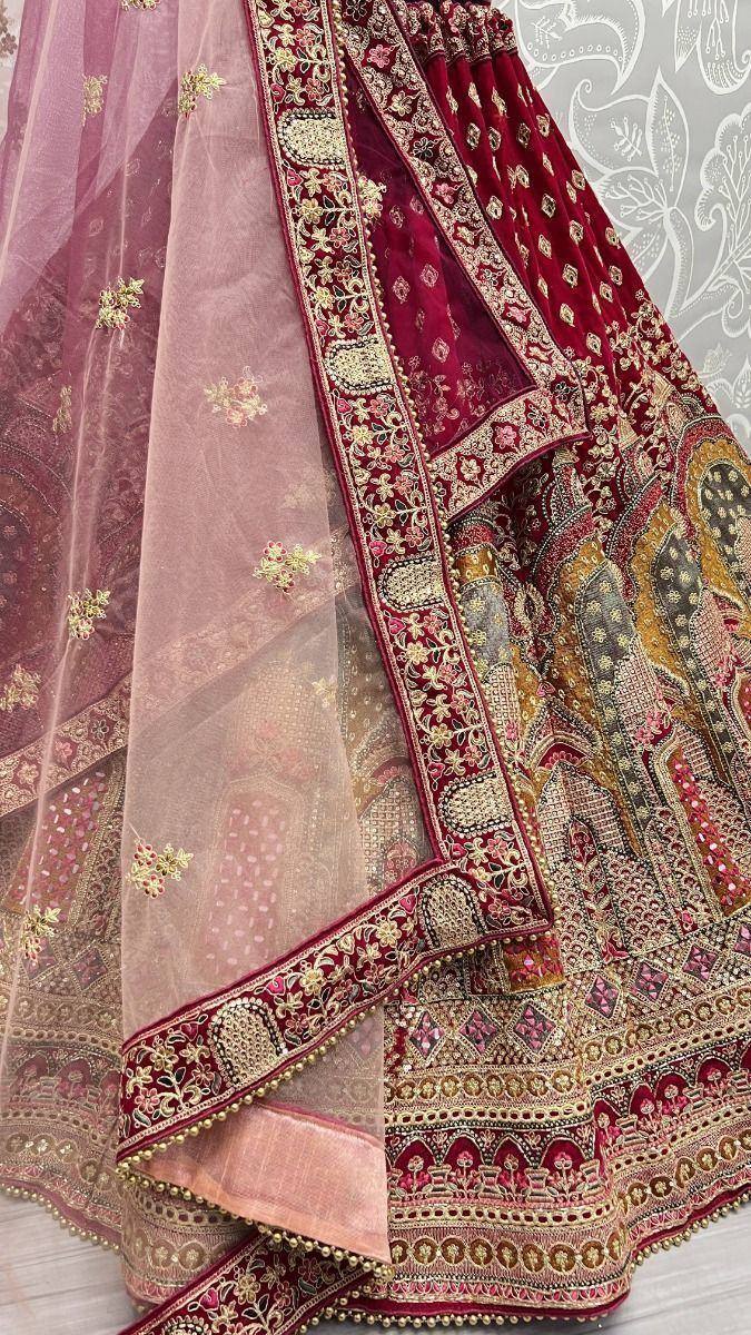 Maroon designer lehenga choli with gold embroidery and sheer dupatta, ethnic Indian wedding wear